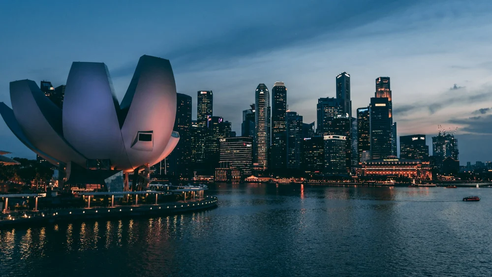 The ArtScience Museum and Singapore skyline at dusk