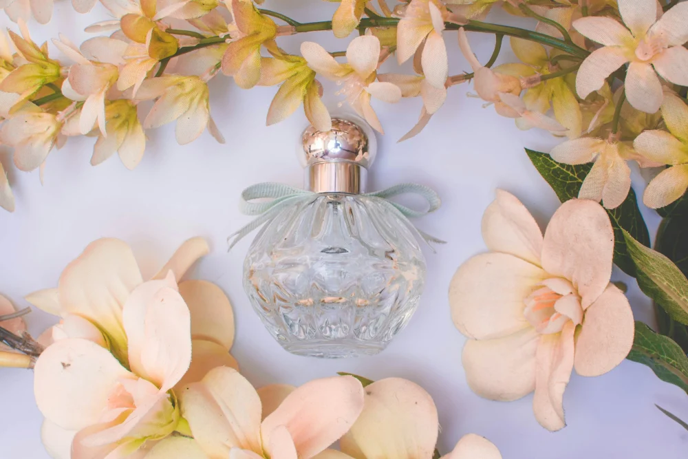 Fragrance bottle with white flowers